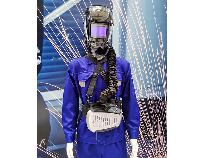 Respirator with welding helmet